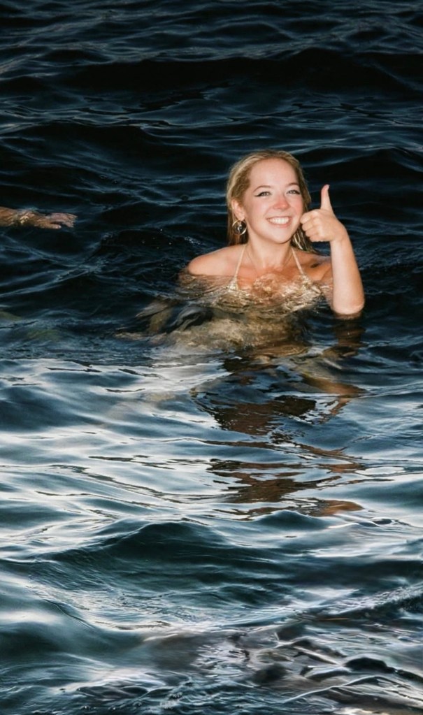 Holly giving a thumbs-up while swimming in the Mediterranean