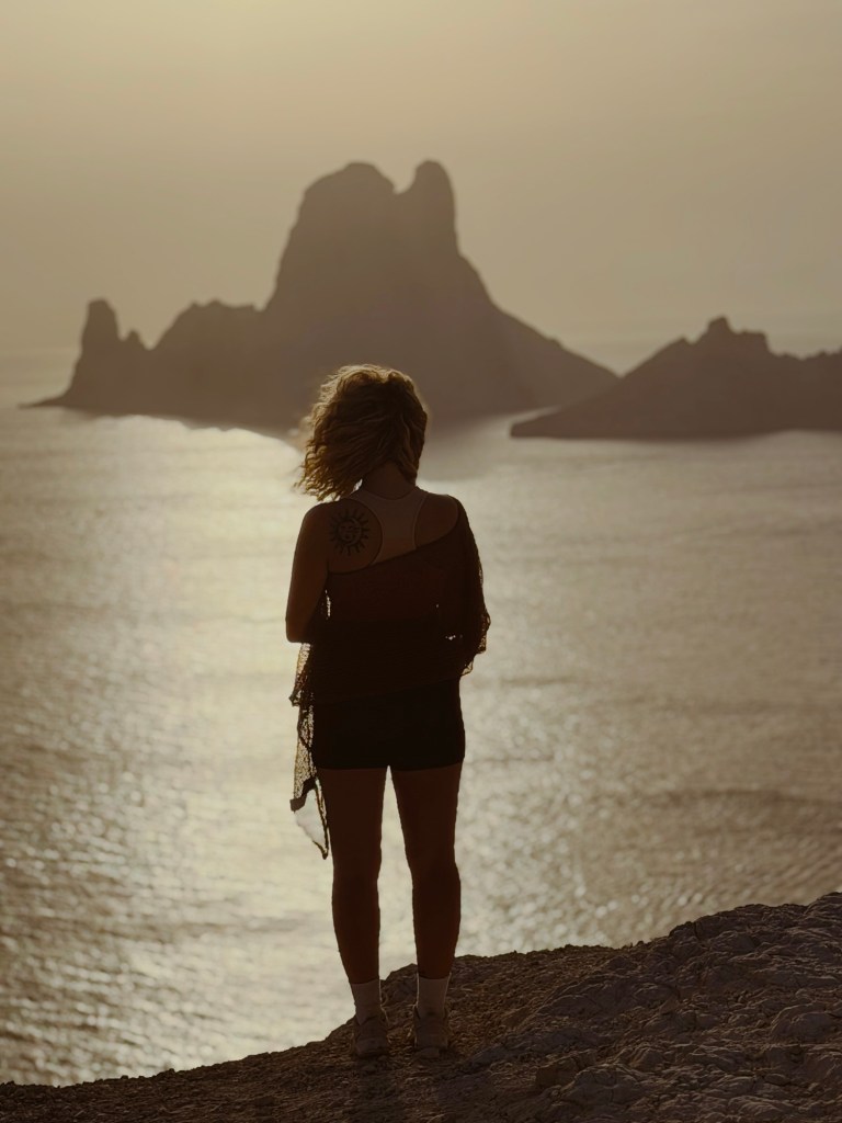 Holly sitting beside the water during an Ibiza island tour