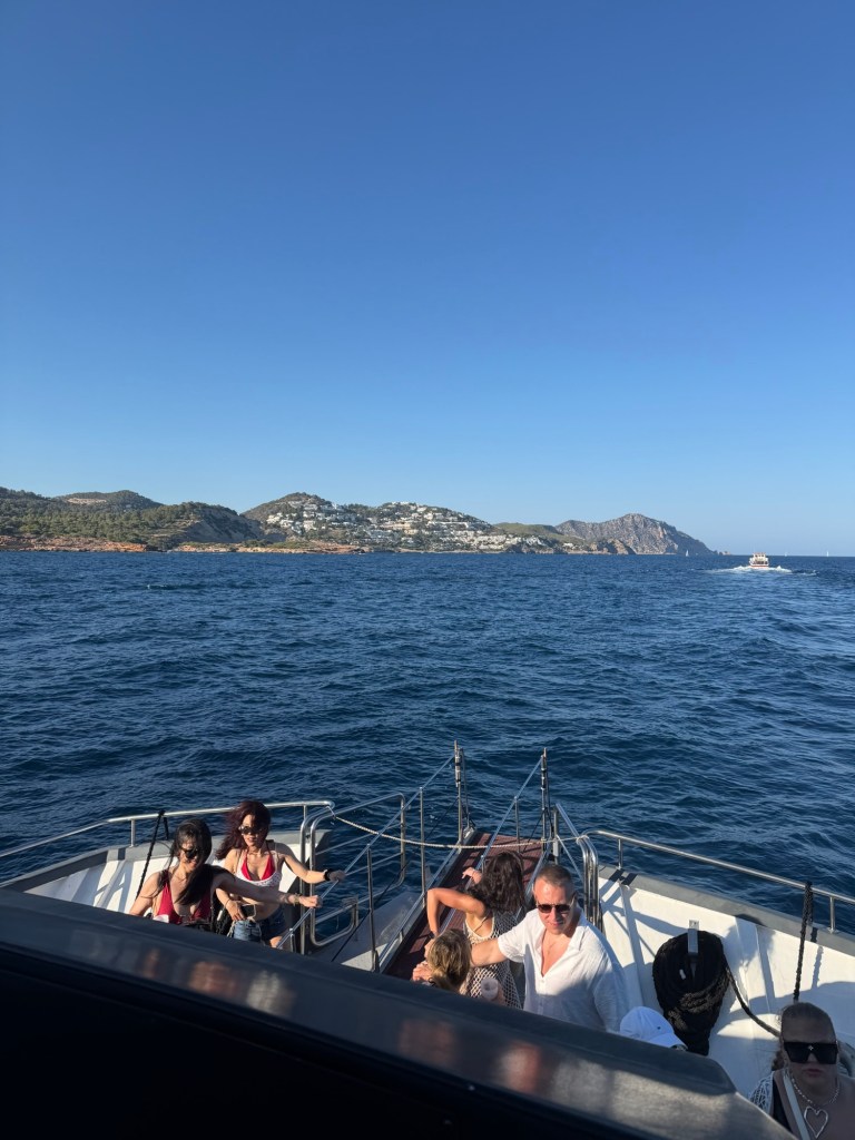 Sunset boat party sailing along the coast of Ibiza