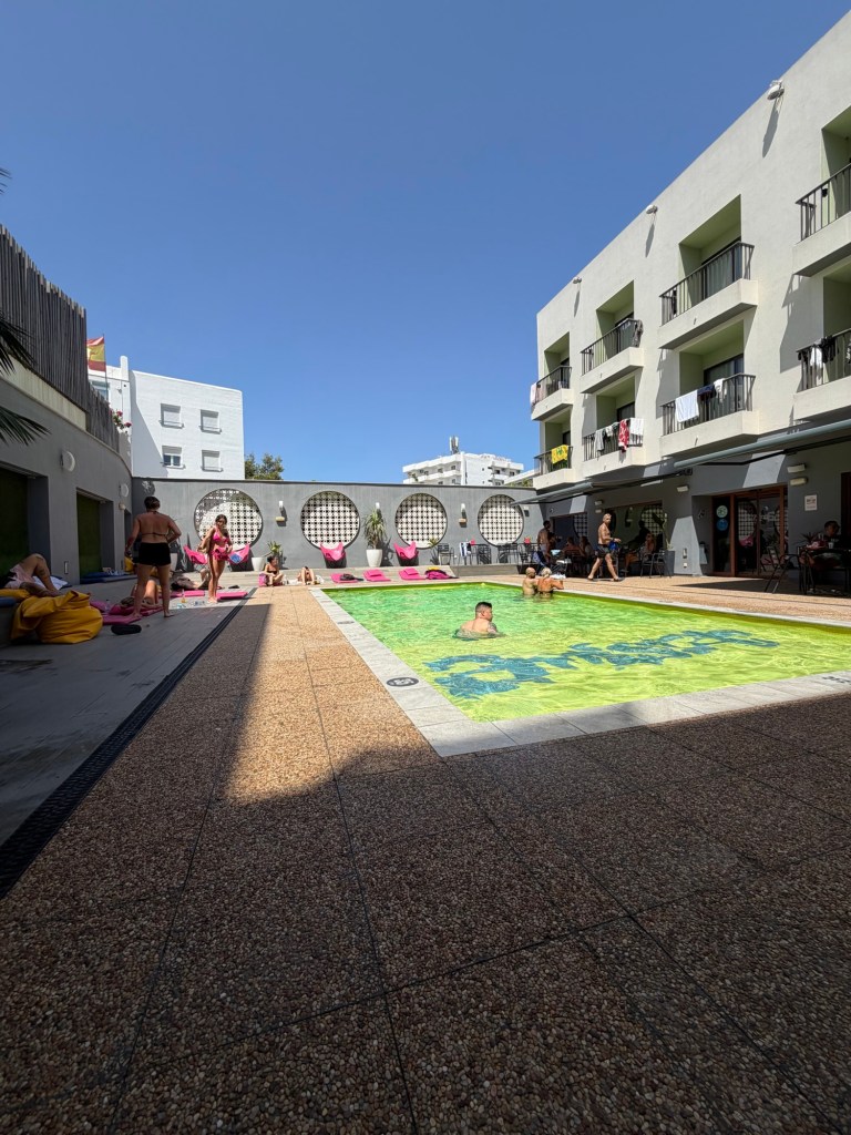 Outdoor pool and balconies at Amistat Island Hostel Ibiza