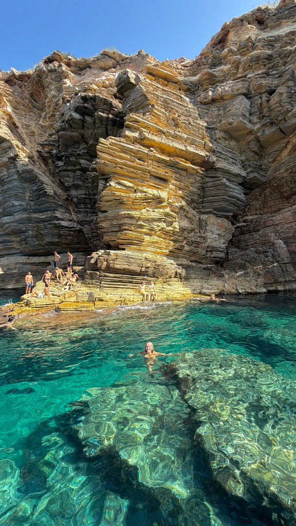 Holly sitting beside the water during an Ibiza island tour